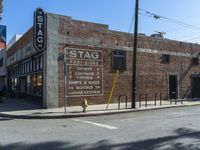 the storefront of a brick store is shown here in this picture taken on a street corner