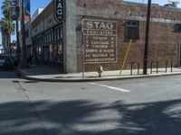 the storefront of a brick store is shown here in this picture taken on a street corner