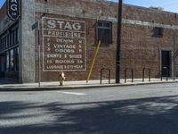 the storefront of a brick store is shown here in this picture taken on a street corner