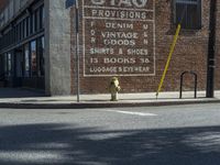 the storefront of a brick store is shown here in this picture taken on a street corner