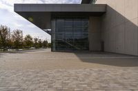 the brick walkway outside a large building is pictured in this photo, it appears to be in motion