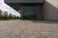 the brick walkway outside a large building is pictured in this photo, it appears to be in motion