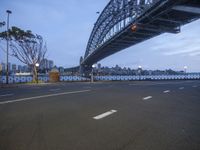 an image of a bridge over the road and buildings in the background in an empty lot