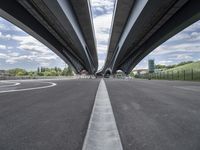 three curved freeway bridges over a wide road in the united states photo by mike stettles