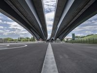 three curved freeway bridges over a wide road in the united states photo by mike stettles