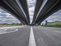 three curved freeway bridges over a wide road in the united states photo by mike stettles