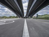 three curved freeway bridges over a wide road in the united states photo by mike stettles