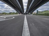 three curved freeway bridges over a wide road in the united states photo by mike stettles