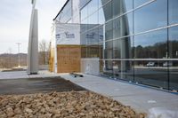 a picture of a building under construction in front of the glass wall of the building