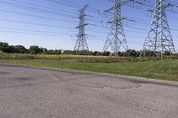 the high voltage line has broken out near some power lines as it stretches along a road