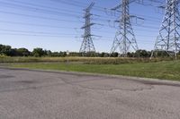 the high voltage line has broken out near some power lines as it stretches along a road