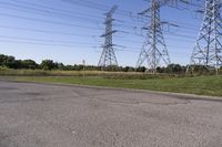 the high voltage line has broken out near some power lines as it stretches along a road