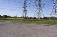 the high voltage line has broken out near some power lines as it stretches along a road