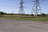 the high voltage line has broken out near some power lines as it stretches along a road