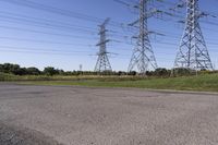 the high voltage line has broken out near some power lines as it stretches along a road