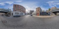 the 360 - vision camera shows traffic passing below street bridges over a busy intersection in brooklyn