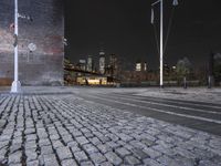night view of brooklyn, new york skyline with street lights and brick sidewalk and steps