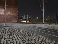 night view of brooklyn, new york skyline with street lights and brick sidewalk and steps