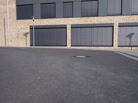 the building is made of brown brick walls and has street signs on it's side