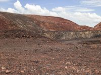 a very barren area with no people in it, with a few hills in the background