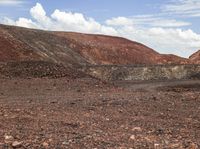 a very barren area with no people in it, with a few hills in the background