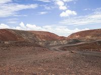 a very barren area with no people in it, with a few hills in the background