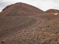 Brown Mountain Slope under Clear Sky: Stunning Landforms