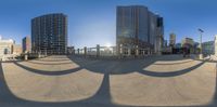 a big building with many curved shadows on it's sides and a road in the foreground