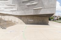 the cement structure with concrete steps, which is built into the concrete roof, in a large city