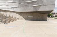 the cement structure with concrete steps, which is built into the concrete roof, in a large city