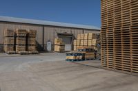 large stacks of pallets in the warehouse area at a building site for palling