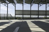 a walkway through the building under construction with an overhang overlay at the top