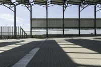 a walkway through the building under construction with an overhang overlay at the top