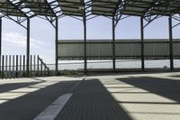 a walkway through the building under construction with an overhang overlay at the top