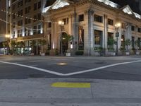 a bus stop and a fire hydrant in an empty street next to the tall buildings