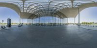 a reflection of a motorcycle in a glass enclosed building by itself with a bicycle leaning against the outside of the glass wall