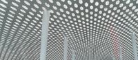 a picture of the ceiling made out of poles and lights that have polka dots on them