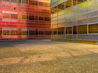 an image of a reflection of some buildings in a glass building complex that is brightly colored