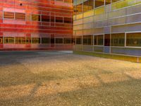 an image of a reflection of some buildings in a glass building complex that is brightly colored