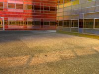 an image of a reflection of some buildings in a glass building complex that is brightly colored