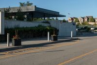 a city street with a few curb boards next to it and a building in the background