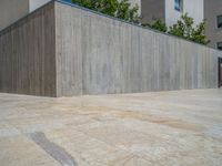 Spain's Business District: A Concrete Wall and Paver Surface