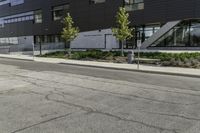 the motorcycle is parked on the street outside of the building next to it's curb