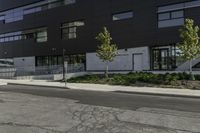 the motorcycle is parked on the street outside of the building next to it's curb