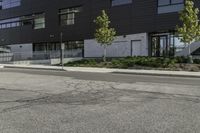 the motorcycle is parked on the street outside of the building next to it's curb