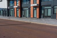 the city is on an empty street in front of the building which is near by