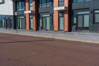 the city is on an empty street in front of the building which is near by