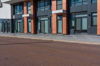 the city is on an empty street in front of the building which is near by