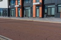 the city is on an empty street in front of the building which is near by