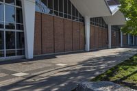 the sidewalk has been empty and is not cleared of grass in front of the building